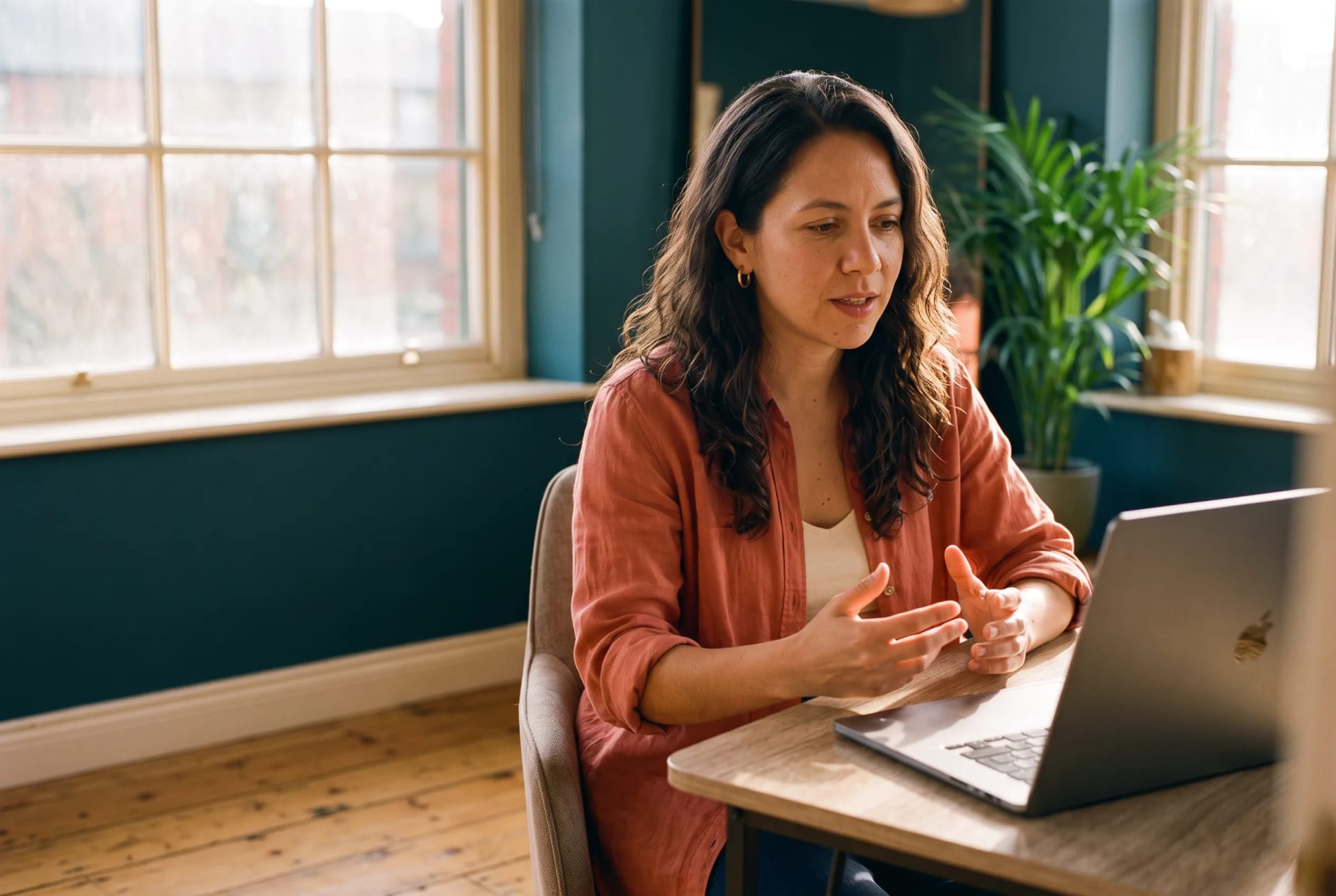 Valentina Reyes, warm and engaged during an online therapy session at the Bright Hour Therapy studio in Manchester